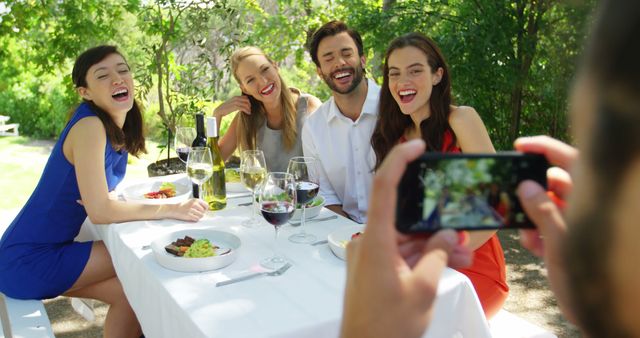 Friends Enjoying Outdoor Meal While Taking Photo - Download Free Stock Images Pikwizard.com