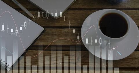 Modern workspace with financial graph overlays