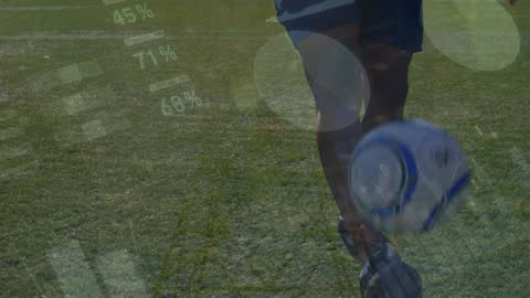 Soccer Player Analyzing Data While Juggling Ball on Field