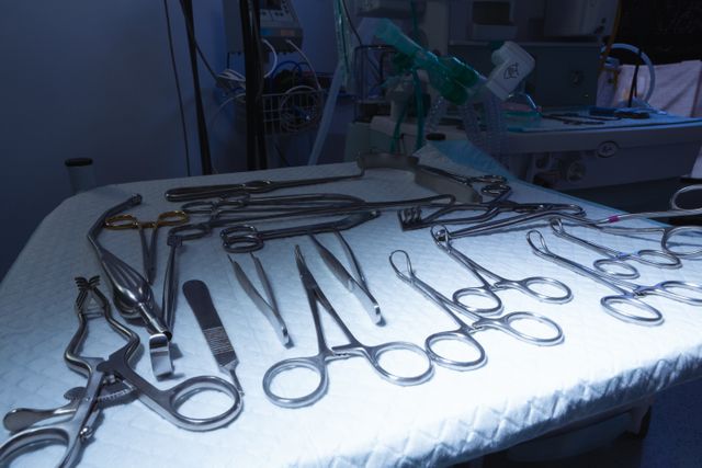 Surgical instruments arranged on table in operation room at hospital - Download Free Stock Photos Pikwizard.com