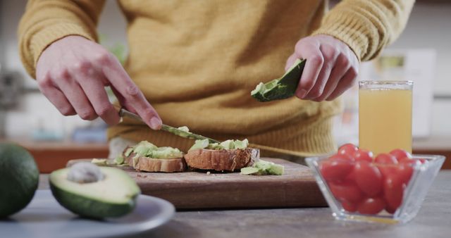 Person Making Avocado Toast in Modern Kitchen - Download Free Stock Images Pikwizard.com