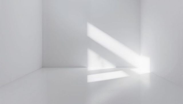 Minimal white room casting diagonal sunbeams across right wall and floor, clean copy space