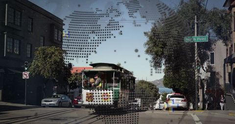 Traditional Cable Car Moving Through Bustling Urban Streets