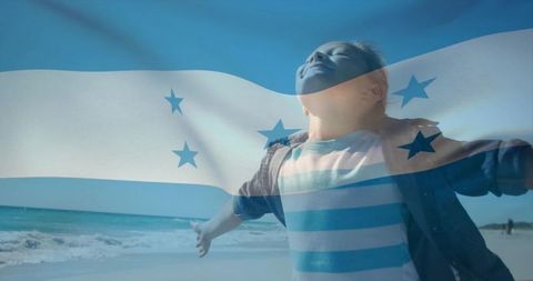 Child embracing freedom on beach with honduras flag double exposure