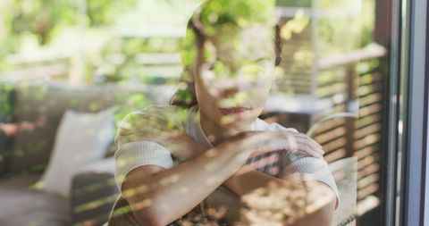 Serene Woman with Vitiligo Sitting, Reflected Through Greenery Outdoors - Download Free Stock Images Pikwizard.com