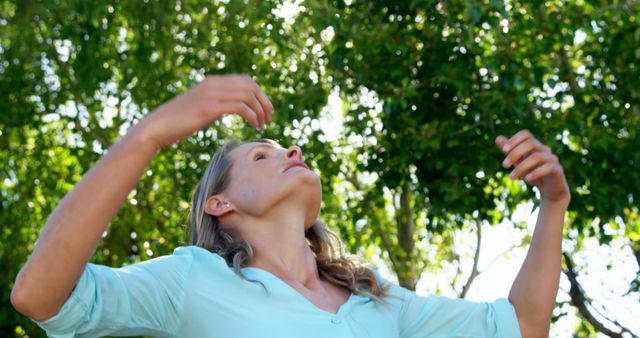 Serene Woman Relaxing Outdoors Among Green Trees - Download Free Stock Images Pikwizard.com