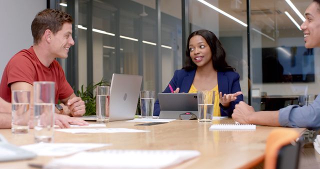 Diverse Team Engaging in Office Meeting Around Conference Table - Download Free Stock Images Pikwizard.com