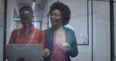 Women Innovators Collaborating in Modern Digital Office Environment