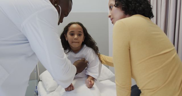 Young Girl in Hospital Bed with Doctor and Concerned Mother - Download Free Stock Images Pikwizard.com