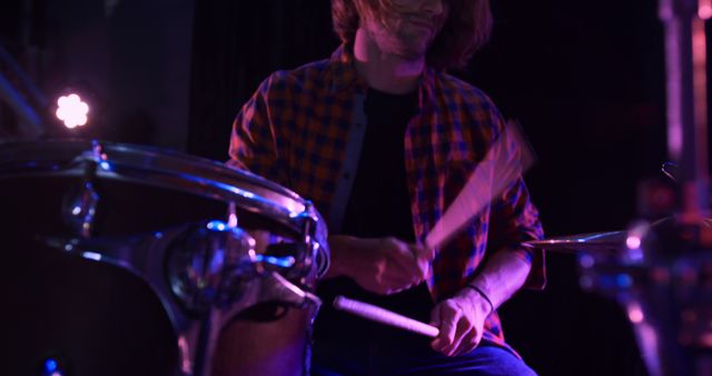 Young Man Playing Drums in Low Light - Download Free Stock Images Pikwizard.com