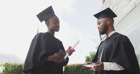 Graduates celebrating academic achievement outdoors