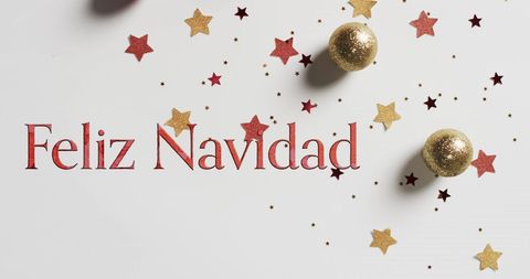 Feliz Navidad Text with Stars and Christmas Baubles on White - Download Free Stock Images Pikwizard.com