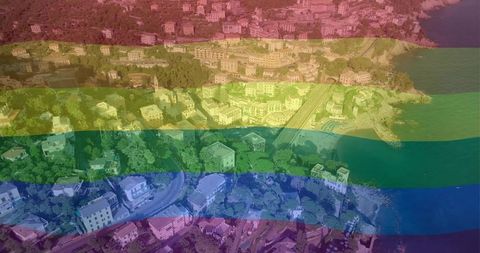 Rainbow-tinted coastal aerial panorama seaside residential hillside and winding roads