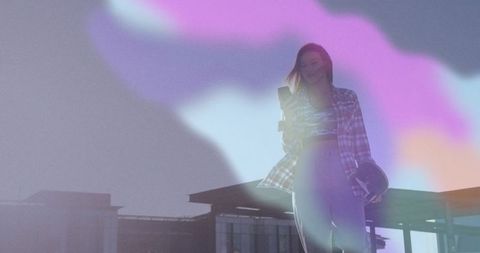 Woman on Rooftop With Vibrant Sky Effect