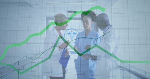 Medical Team Analyzing Growth Chart Data in Hospital Environment