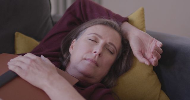 Middle Aged Woman Relaxing on Couch, Napping Peacefully - Download Free Stock Images Pikwizard.com