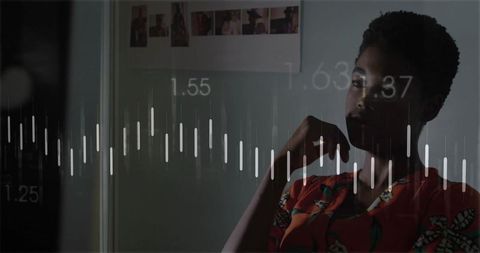 Woman examining data with tech overlay in modern home office