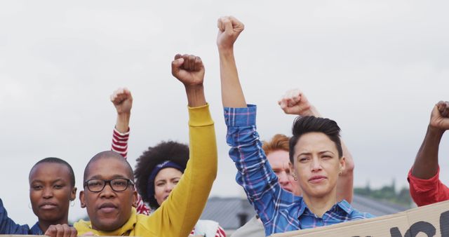 Diverse group of activists protesting and raising fists - Download Free Stock Images Pikwizard.com