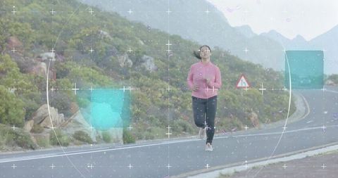 Woman Jogging on Scenic Mountain Road Surrounded by Nature