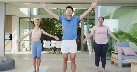 Diverse Group Engaging in Relaxing Outdoor Yoga Session