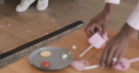 Messy celebration aftermath with cookies and strawberry