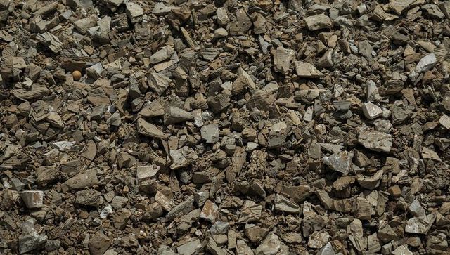Rubble and broken concrete chunks creating rugged gravel texture for construction