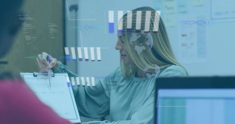 Businesswoman pointing at clipboard during data-driven meeting with hud charts overlay