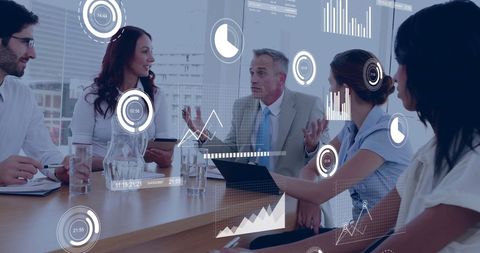 Diverse professionals in corporate meeting with data visualizations