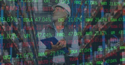 Warehouse worker analyzing financial data and stock market projections