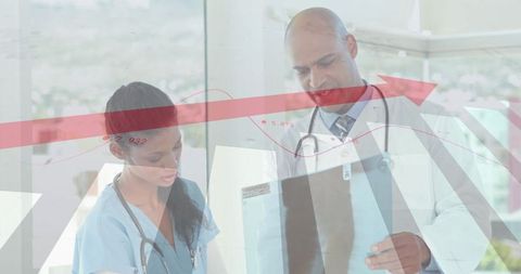 Doctor and Nurse Analyzing X-Ray with Data Overlay