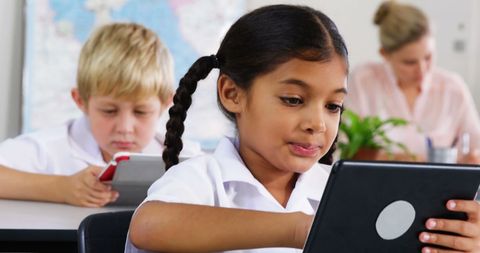 Schoolchildren Engaged in Learning with Digital Tablets in Classroom - Download Free Stock Images Pikwizard.com