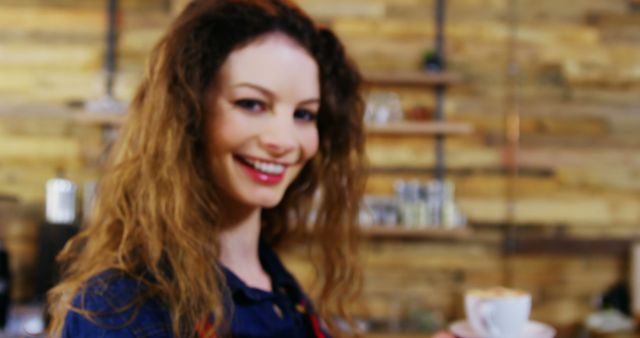 Smiling Barista Holding Cup of Coffee in Cozy Cafe - Download Free Stock Images Pikwizard.com