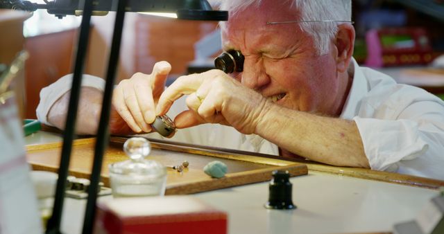 Horologist Carefully Repairs Watch with Precision Tool - Download Free Stock Images Pikwizard.com