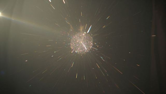 Abstract glowing sphere dispensing dynamic light rays