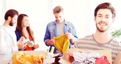 Young Adults Collaborating in Clothing Donation Event - Download Free Stock Images Pikwizard.com