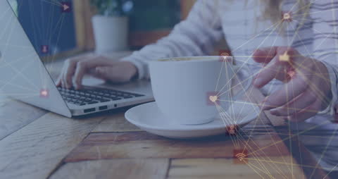 Woman Connecting Through Laptop in Cozy Cafe Setting