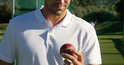 Cricket player focusing on ball during training session