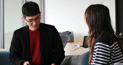 Asian business colleagues collaborating in modern office space