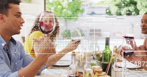 Friends sharing wine and passing plates at garden table with face shield and ar overlay