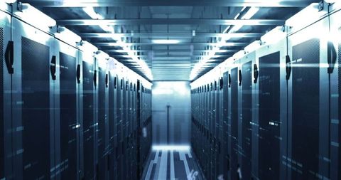 Modern data center with blue-tinted server racks and digital data concept