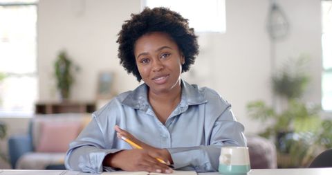 Happy Professional Woman Engaging in Video Conference at Work