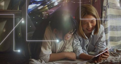 Joyful Mother and Daughter Using Tablet Together