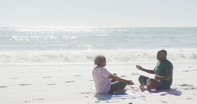 Senior Couple Meditating on Beach - Download Free Stock Images Pikwizard.com