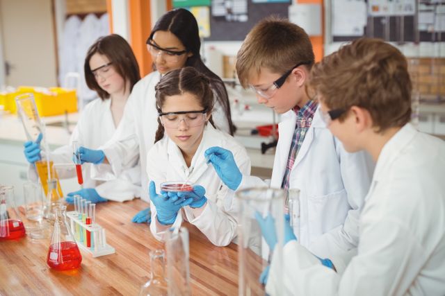 Diverse School Kids Conducting Chemistry Experiment in Laboratory - Download Free Stock Photos Pikwizard.com