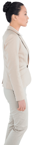 Transparent Side View of Focused Asian Businesswoman in Beige Suit