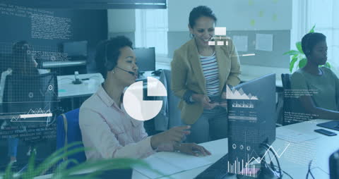 Diverse Businesswomen Analyzing Data with Technology Interface in Office