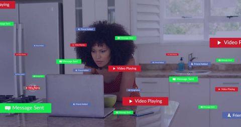 Focused Woman Engaged Online with Smartphone Notifications at Kitchen Island