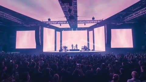 Electrifying Concert with LED Displays and Enthusiastic Audience