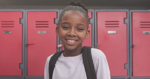 Confident Young Student Posing Near School Lockers
