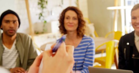 Diverse Professionals Engaged in Collaborating at Office Meeting